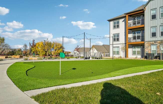 the estates at tanglewoodbuilding exterior with green lawn and sidewalk