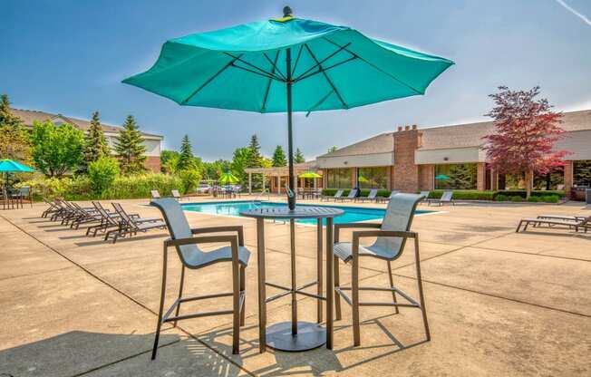 our apartments have a pool and chairs with umbrellas