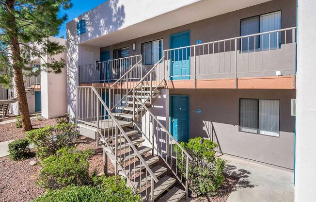 A building with a staircase leading to a balcony.
