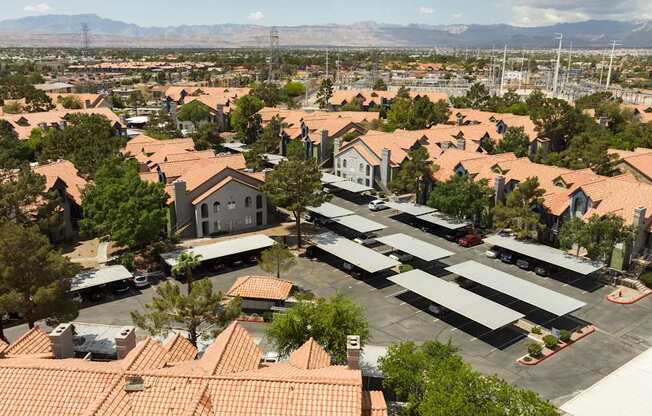 an aerial view of a suburban neighborhood with houses and cars