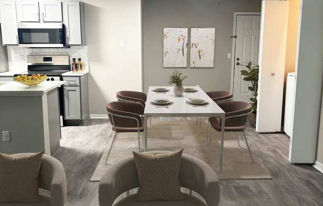 A modern kitchen with a dining table and chairs.