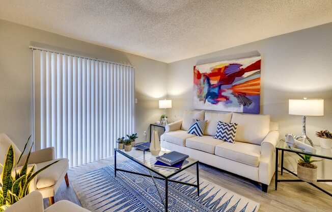 a living room with a white couch and a coffee table