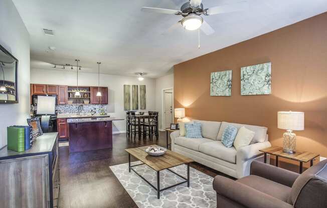 Model Unit - Living Room with Brown Accent Wall  at Overlook at Stone Oak Park Apartments, San Antonio, Texas