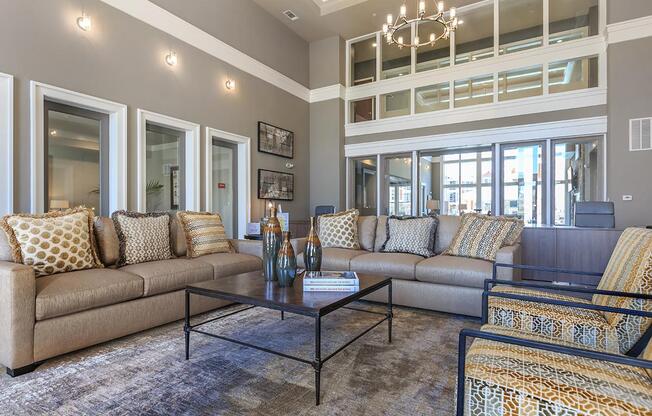 a living room filled with furniture and a large window