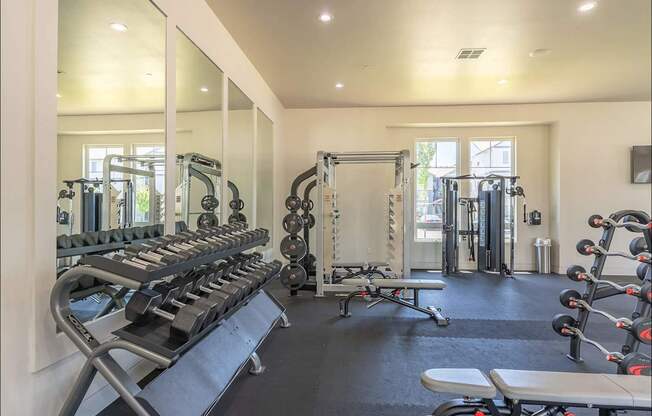 A well-equipped gym with mirrors on the wall at Northplace Apartment Homes, Salem