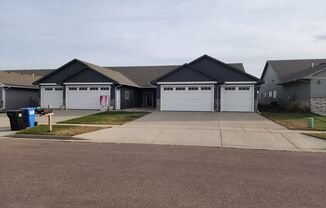 Three bedroom two bath Twin Home w/ Triple garage