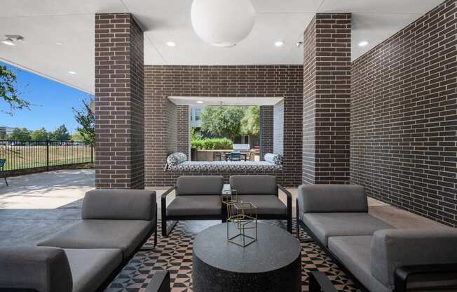 a lounge area with couches and a coffee table at Abstract at Design District, Dallas, TX