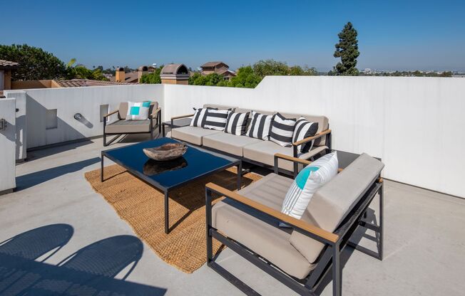 Upscale & Spacious, Spanish Style Tri-Level Townhome w/ Amazing Great Room Living Space, Rooftop Deck, 2 Balconies, Rear Yard & 2-Car Garage Close to Schools, Shopping & Just 2 Blocks to MB Border & 5 Mins to Beach!