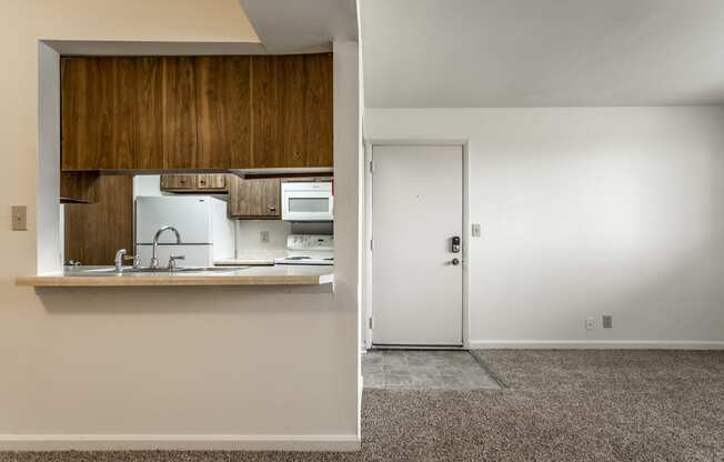 a view of a kitchen and a door in a house