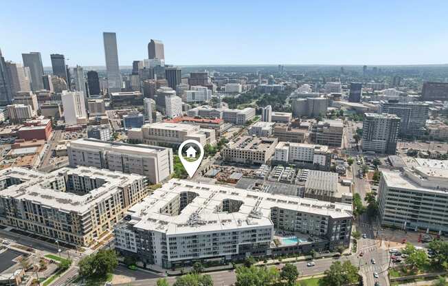 A cityscape with a clear blue sky and buildings of various heights.