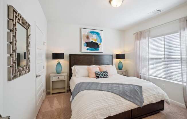 Bedroom with a large bed and a window  at The Meadows, Georgia, 31302