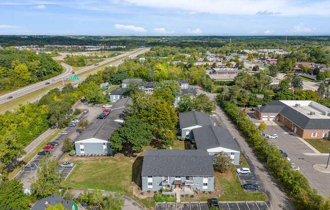 A bird's eye view of a small town with a road running through it.