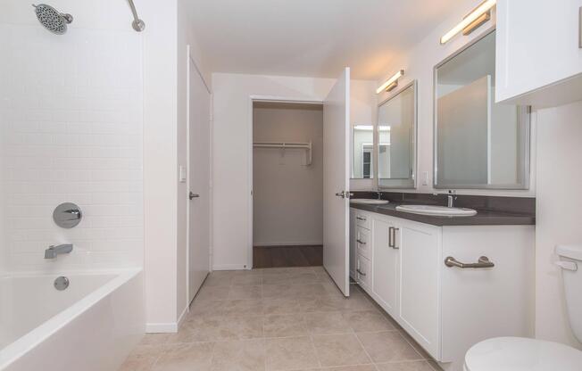 a room with a sink and a mirror