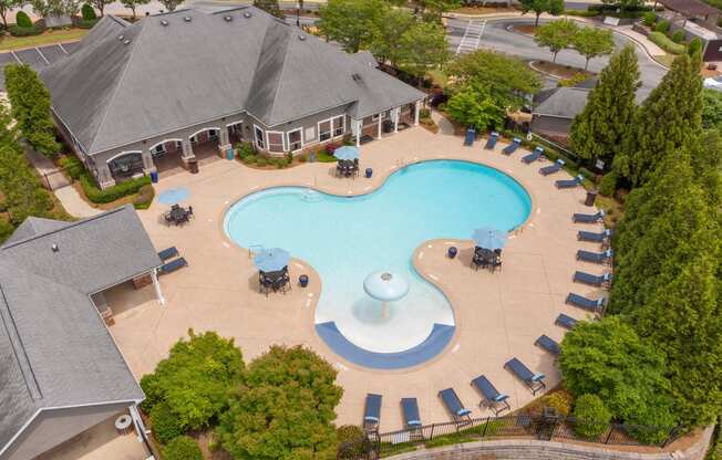 an aerial view of an outdoor swimming pool at a resort