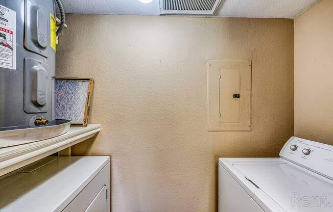 a washer and dryer in a laundry room with a door