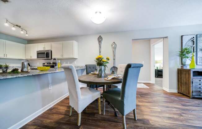 Dining Area with Table and 4 chairs visible from the kitchen area