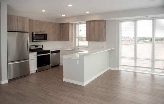 2 bedroom marc floor plan corner apartment with spacious kitchen, over the sink window and breakfast bar at Urban Park I and II Apartments, St Louis Park
