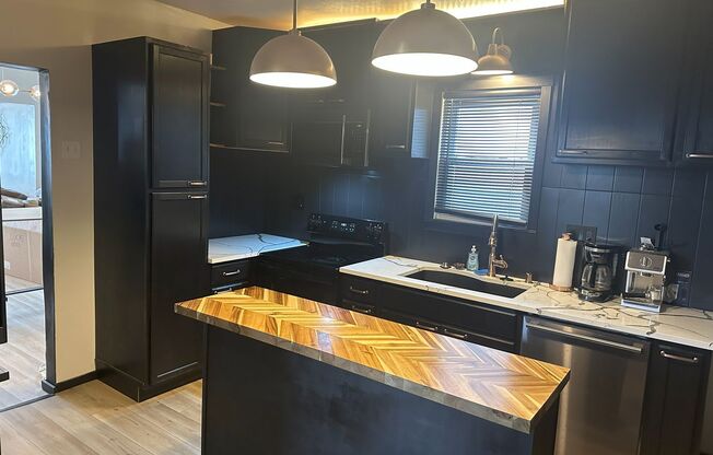 Beautifully Remodeled 2-Bedroom with Bonus Room, 2 Baths & Prime Amenities