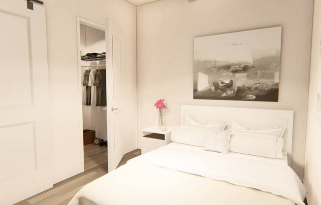 a bedroom with a large bed and a closet at Brownstones at Palisade Park Townhomes, Broomfield, 80023