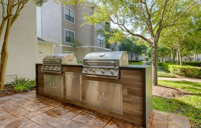 a stainless steel outdoor grill with two bbqs at Summerwind, Pearland Texas