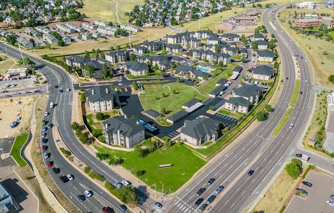 an aerial view of a neighborhood of houses with an intersection