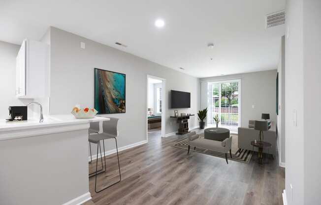 an open living room and kitchen with a table and chairs and a couch