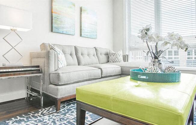 a living room with a couch and a table