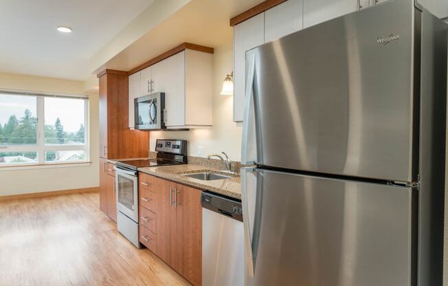 The Morgan | #404 Kitchen with beautiful cabinetry and stainless steel appliances