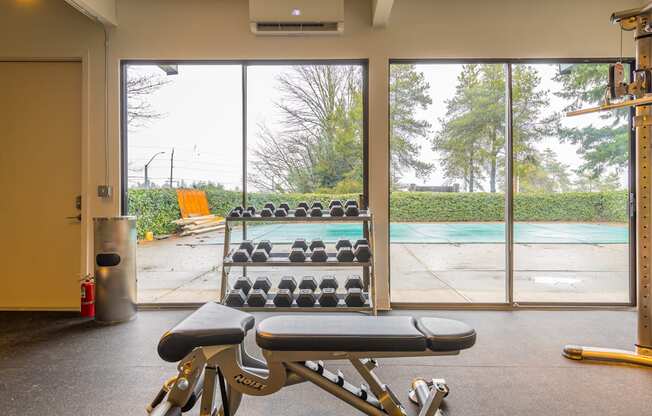 a gym with a pool in the background