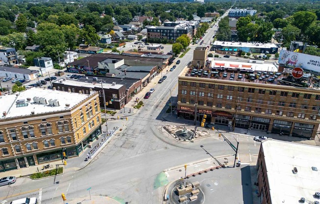 A city intersection with a roundabout in the middle.