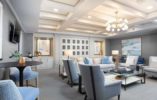 Resident lounge with tables and chairs at St Mary's Square North Apartments, North Carolina, 27605